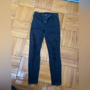 Black skinny jeans with small rip